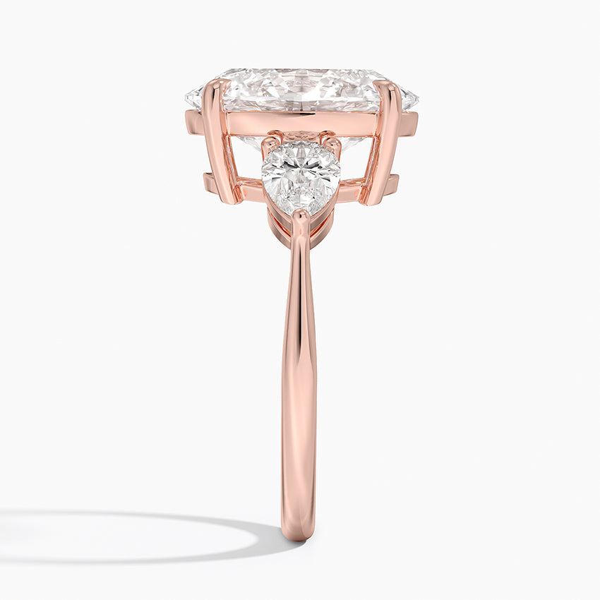 Oval Cut Three-Stone Diamond Engagement Ring with Pear Sides in Solid Gold⁠