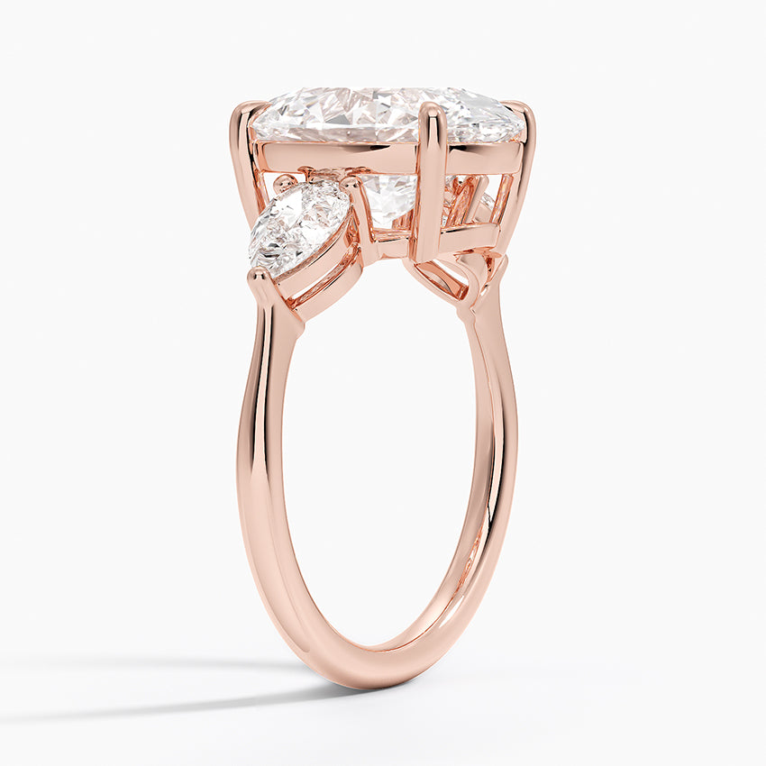 Oval Cut Three-Stone Diamond Engagement Ring with Pear Sides in Solid Gold⁠