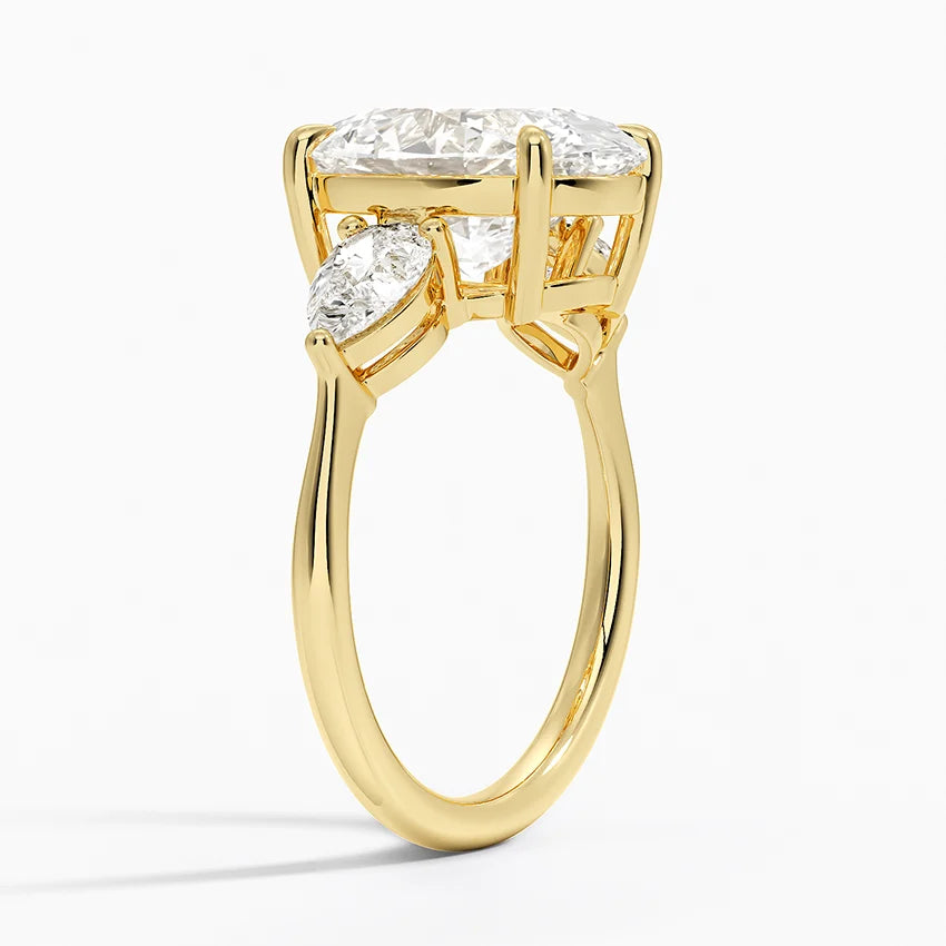Oval Cut Three-Stone Diamond Engagement Ring with Pear Sides in Solid Gold⁠