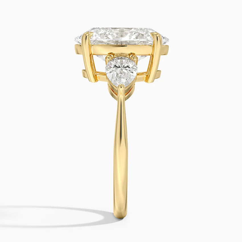 Pear Cut Three-Stone Engagement Ring in Solid Gold⁠