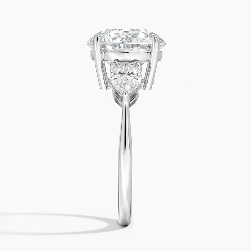 Pear Cut Three-Stone Engagement Ring in Solid Gold⁠