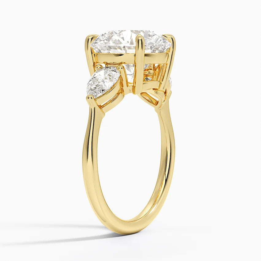 Pear Cut Three-Stone Engagement Ring in Solid Gold⁠