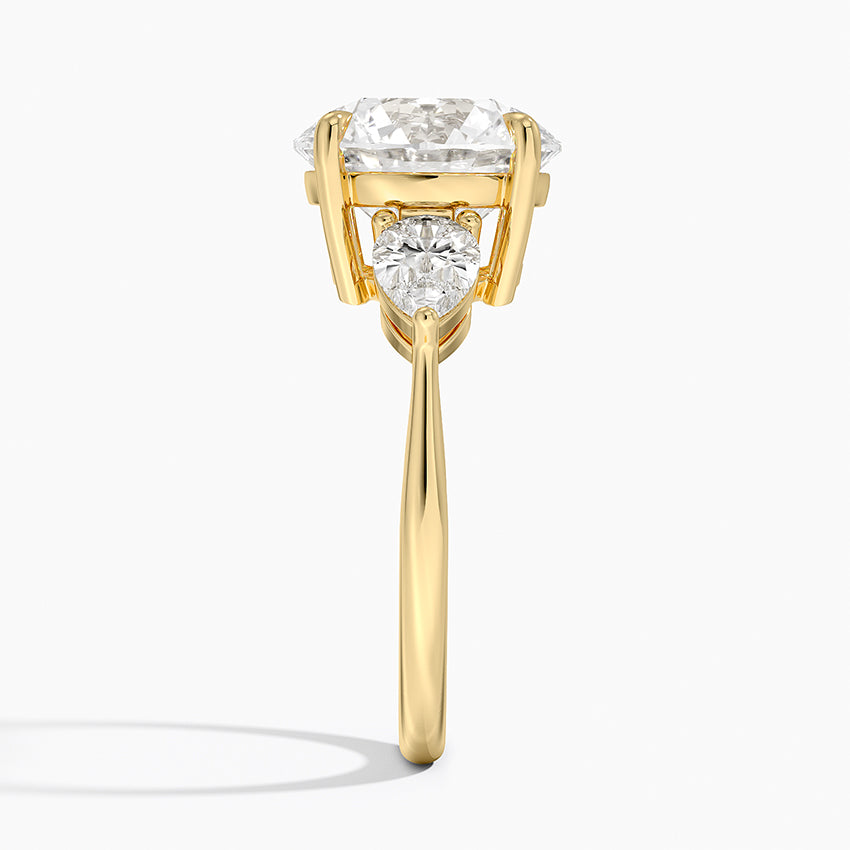 Pear Cut Three-Stone Engagement Ring in Solid Gold⁠