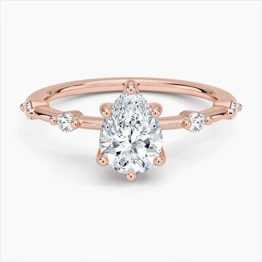 Pear Cut Accent Station Engagement Ring in Solid Gold