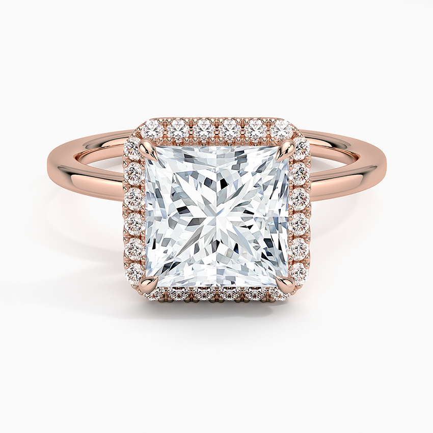 Princess cut diamond halo engagement ring in rose gold with pavé band
