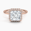 Princess cut halo engagement ring with rose gold band and diamond accents