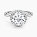 Round halo lab-grown diamond engagement ring with pavé setting on white gold band