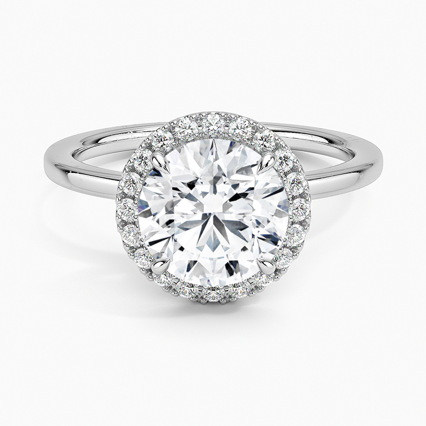 Round halo lab-grown diamond engagement ring with pavé setting on white gold band