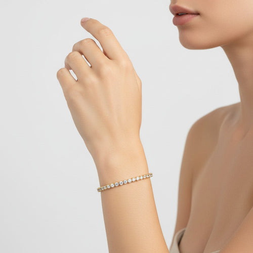 My Store 4 18K solid gold bracelet featuring round lab-grown diamonds in sleek bezel settings on a woman's wrist.