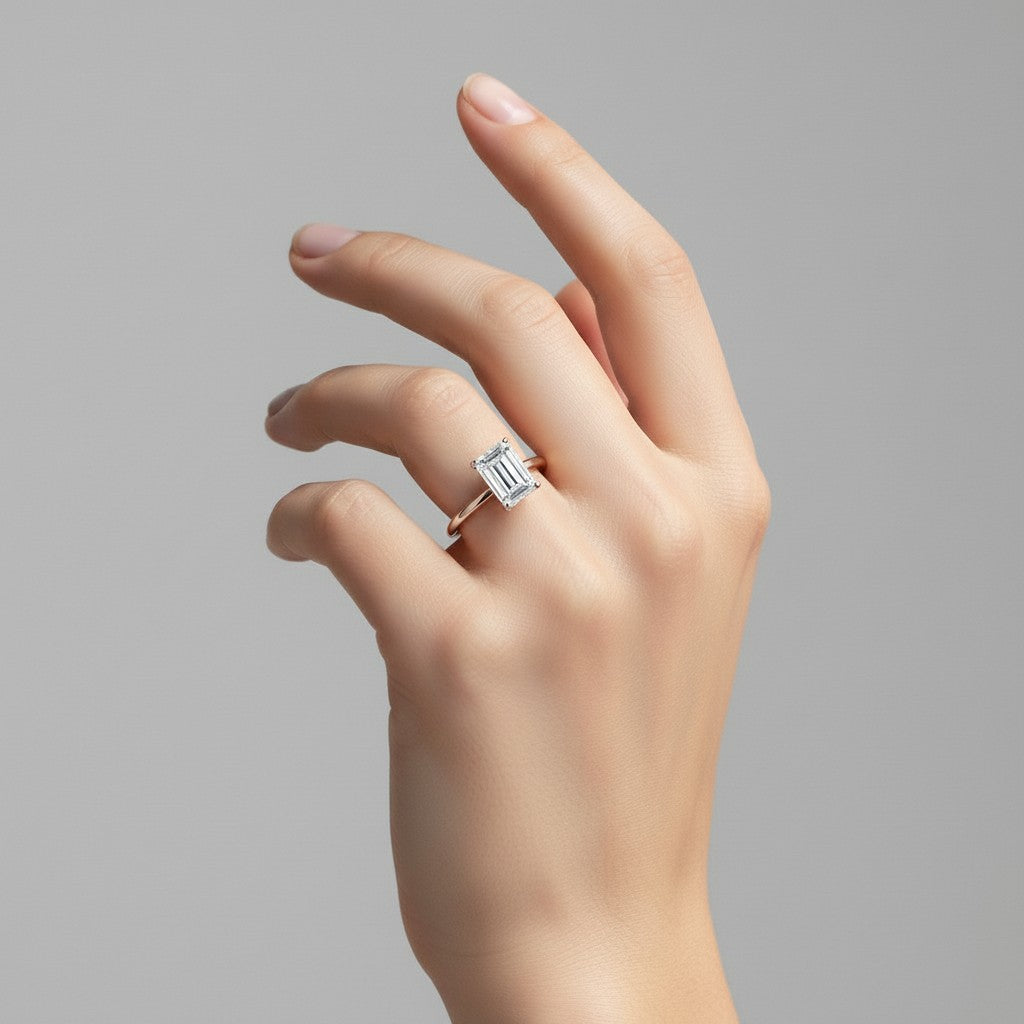 My Store 4 18K solid gold halo ring featuring a radiant emerald-cut lab-grown diamond on a woman's hand.
