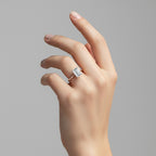 My Store 4 18K solid gold halo ring featuring a radiant emerald-cut lab-grown diamond on a woman's hand.