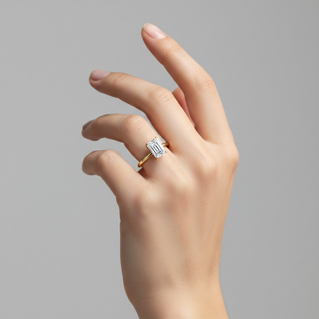 My Store 4 18K solid gold halo ring featuring an emerald-cut lab-grown diamond worn on a woman's finger