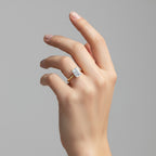 My Store 4 18K solid gold halo ring featuring an emerald-cut lab-grown diamond worn on a woman's finger