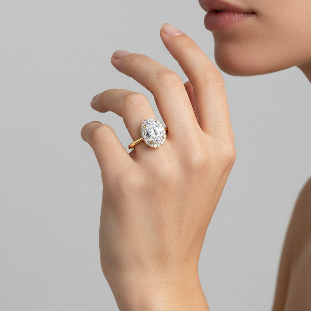 My Store 4 18K solid gold halo ring featuring a brilliant oval lab-grown diamond on a woman's finger