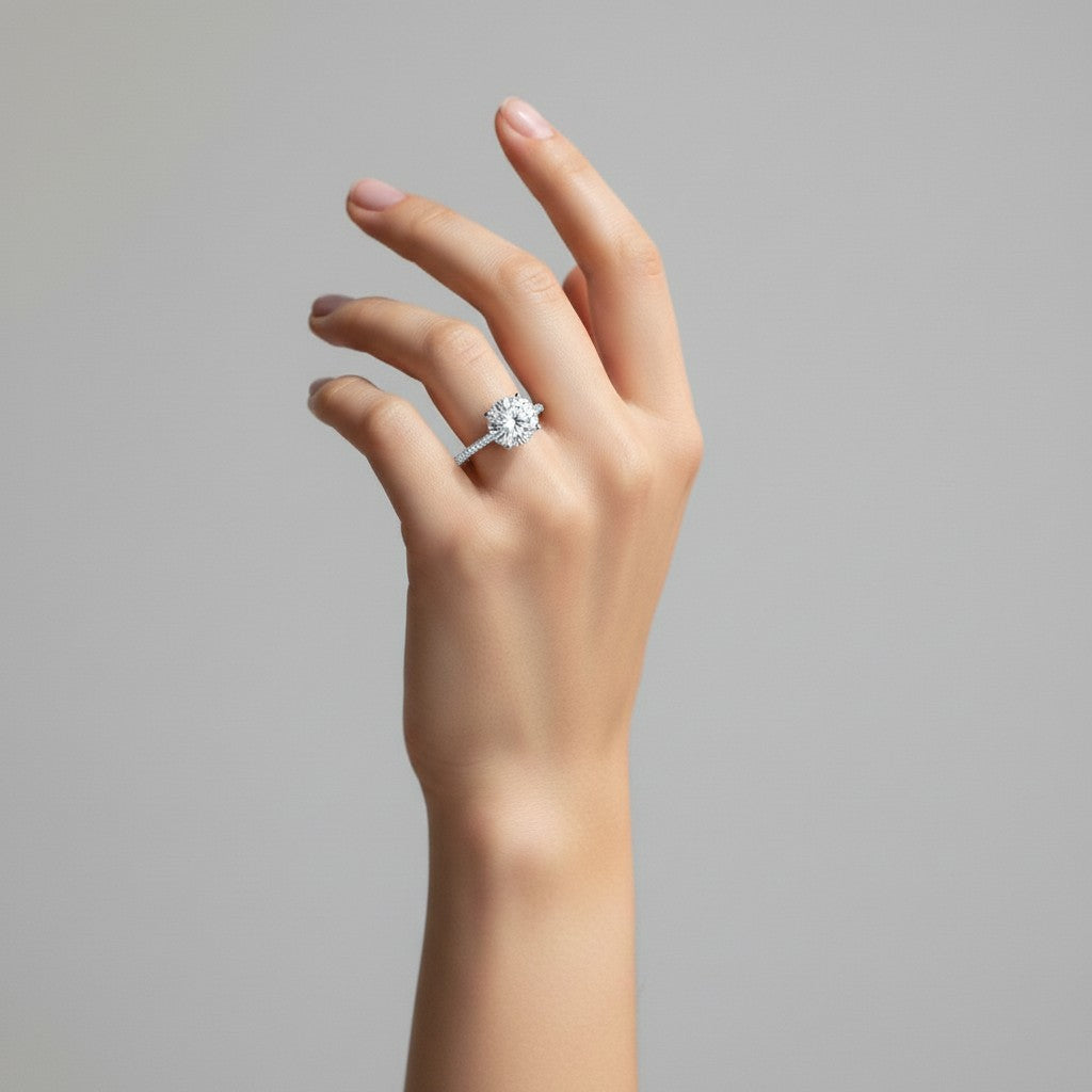 My Store 4 18K solid gold pavé lab-grown diamond ring worn on a woman's finger, showcasing a brilliant round stone.