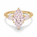 My Store 4 18K solid gold three-stone ring featuring a pear-cut lab-grown diamond with two smaller side diamonds.