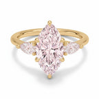 My Store 4 18K solid gold three-stone ring featuring a pear-cut lab-grown diamond with two smaller side diamonds.