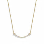 My Store 4 18K solid gold smile necklace featuring a curved bar pendant set with sparkling lab-grown diamonds.