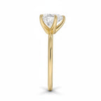 My Store 4 18K solid gold solitaire diamond ring viewed from the side, showcasing the prong setting and polished band.