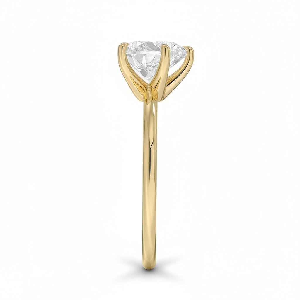 My Store 4 18K solid gold solitaire diamond ring viewed from the side, showcasing the prong setting and polished band.