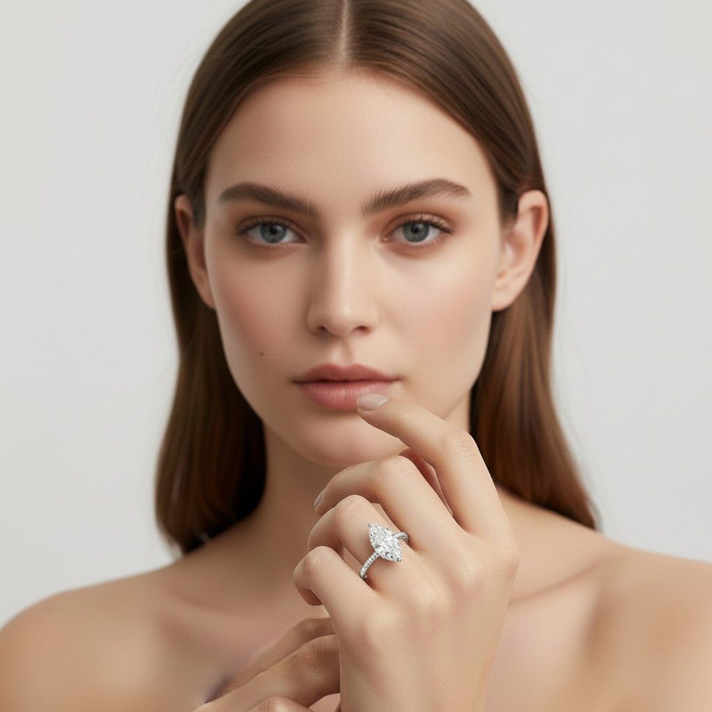 My Store 4 18K solid gold solitaire lab-grown diamond ring worn on the finger of a woman with long brown hair.