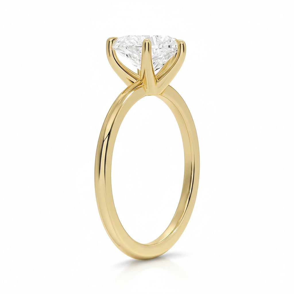 My Store 4 18K solid gold solitaire diamond ring with a classic four-prong setting on a white background
