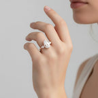 My Store 4 18K solid gold trilogy ring featuring a pear-cut lab-grown diamond flanked by two smaller side stones.