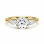 My Store 4 18K solid gold trilogy ring featuring a central round and two pear-cut lab-grown diamonds.