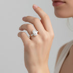 My Store 4 18K solid gold trilogy ring featuring a pear-cut lab-grown diamond flanked by two smaller side stones.