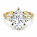 My Store 4 18K solid gold trilogy ring featuring a pear-cut lab-grown diamond flanked by two smaller pear diamonds.
