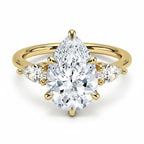 My Store 4 18K solid gold trilogy ring featuring a pear-cut lab-grown diamond flanked by two smaller pear diamonds.