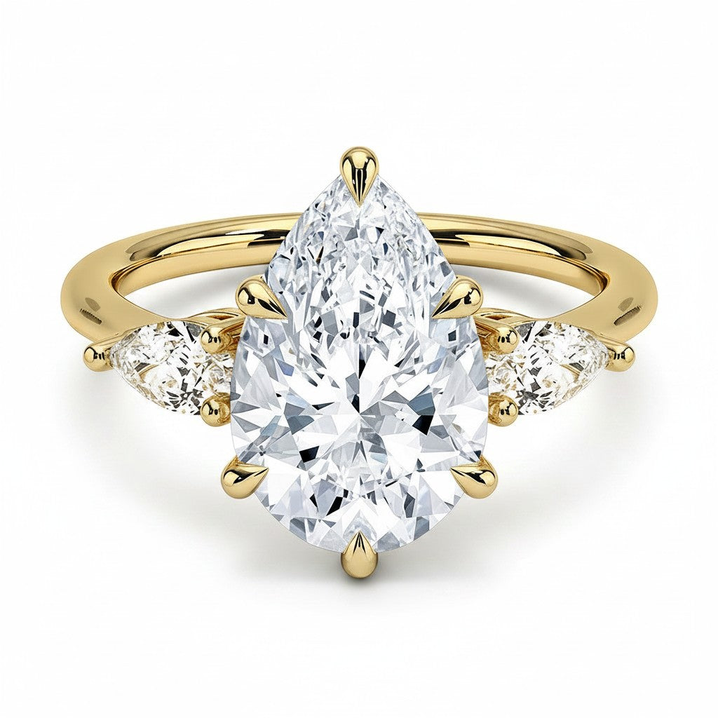 My Store 4 18K solid gold trilogy ring featuring a pear-cut lab-grown diamond flanked by two smaller pear diamonds.