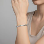 My Store 4 modern bezel diamond line bracelet in white gold worn on a woman's wrist