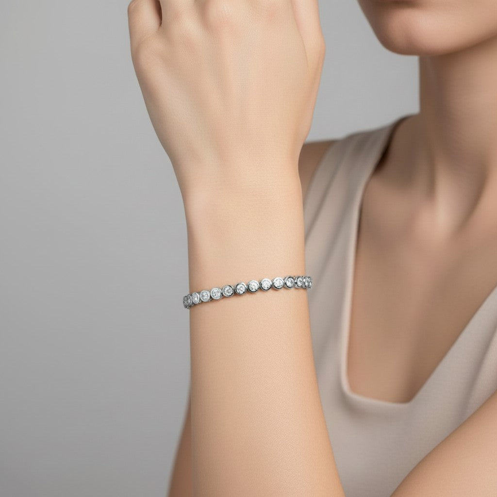 My Store 4 modern bezel diamond line bracelet in white gold worn on a woman's wrist