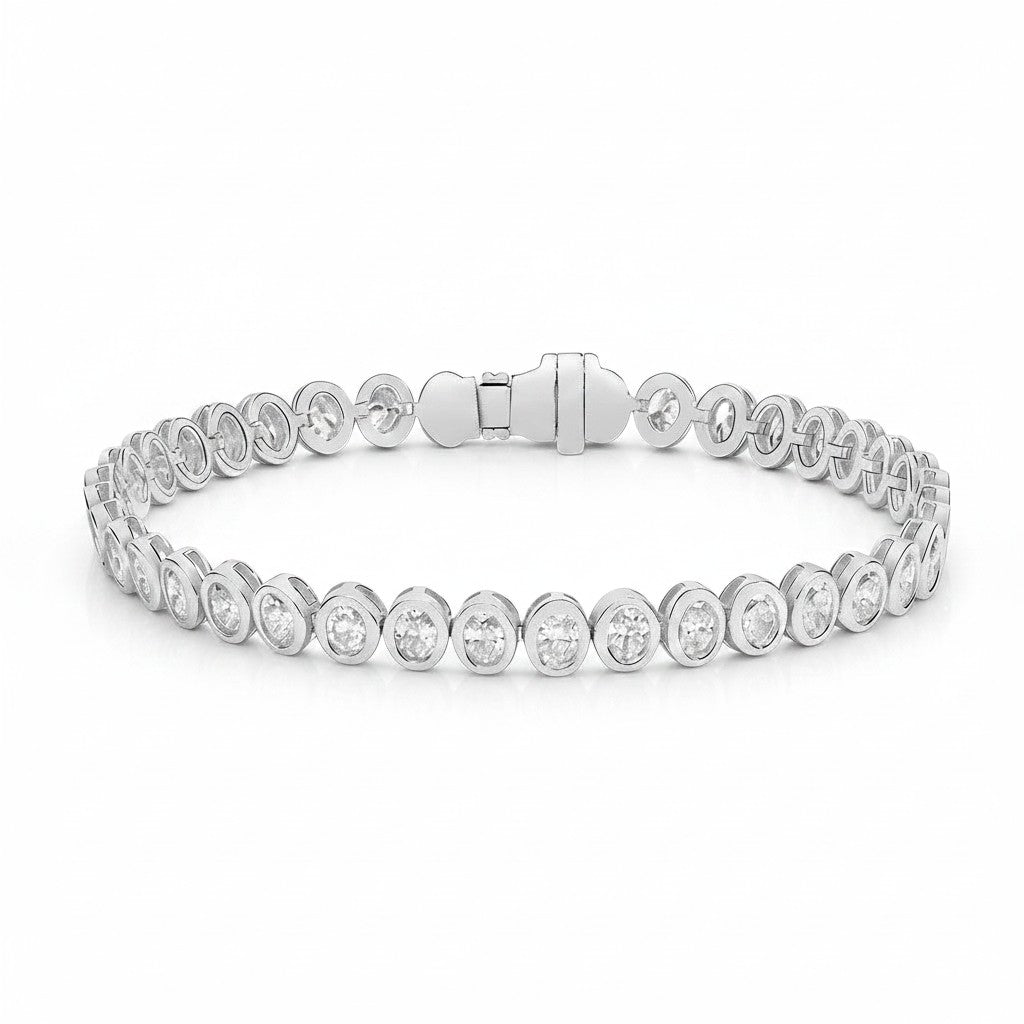 My Store 4 bezel set diamond tennis bracelet in white gold with round cut stones and a secure box clasp.