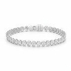 My Store 4 bezel set diamond tennis bracelet in white gold with round cut stones and a secure box clasp.