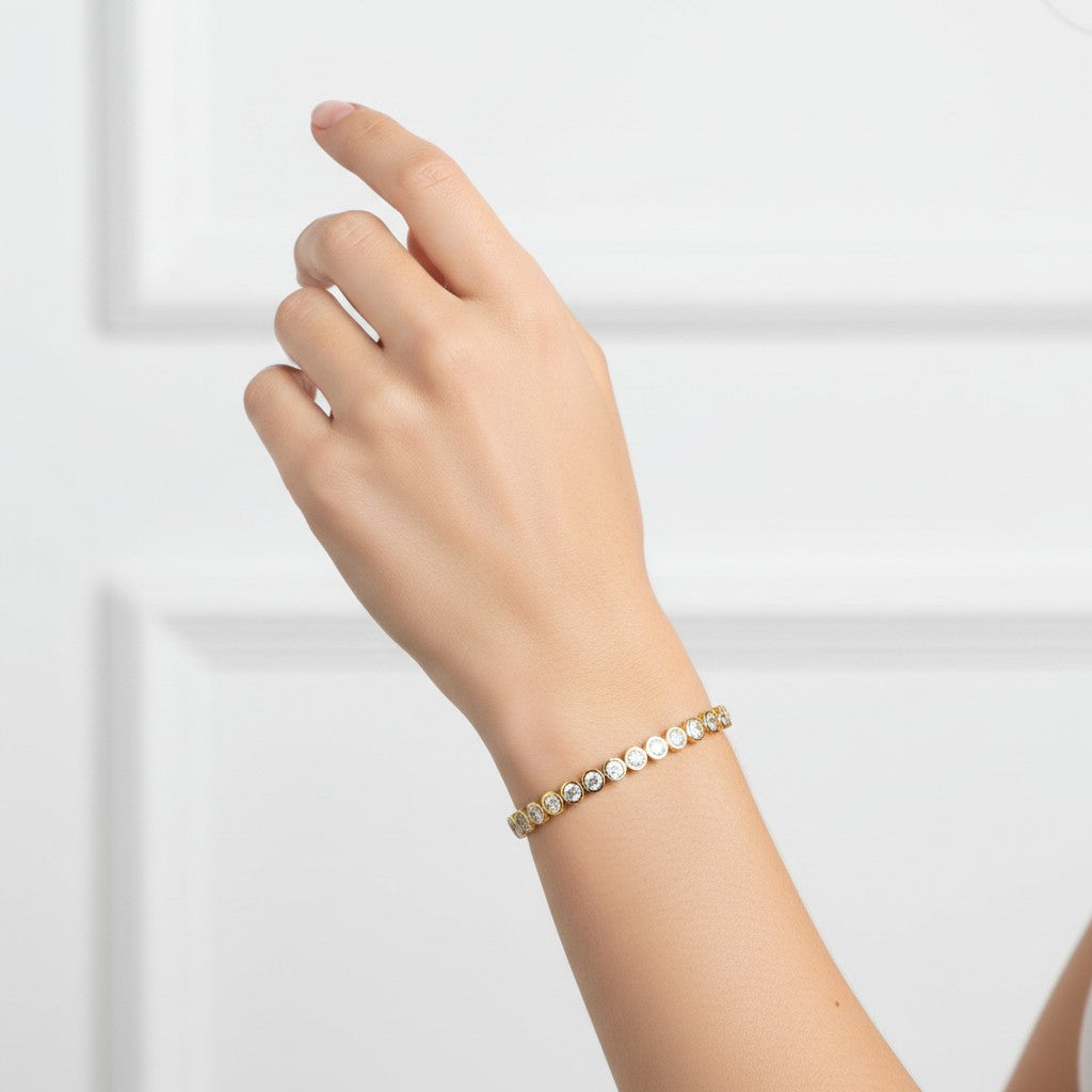 My Store 4 round cut diamond tennis bracelet in 14K yellow gold with a smooth protective bezel setting on a wrist