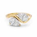 My Store 4 bypass engagement ring featuring two pear-cut diamonds in an S-curve 18K yellow gold band.