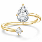 My Store 4 bypass engagement ring in 18k yellow gold with a pear-cut focal diamond and a round-cut accent stone.