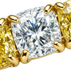 My Store 4 tennis bracelet featuring alternating cushion-cut fancy yellow and white diamonds in yellow gold box settings.