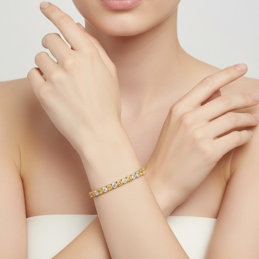 My Store 4 two-tone tennis bracelet featuring alternating fancy yellow and white cushion-cut diamonds in gold settings.