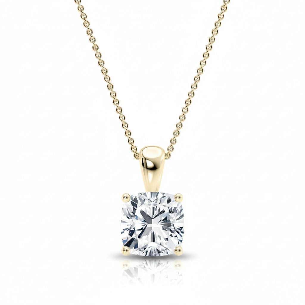 My Store 4 cushion-cut diamond solitaire pendant in 18K yellow gold with a tapered bail and delicate chain.