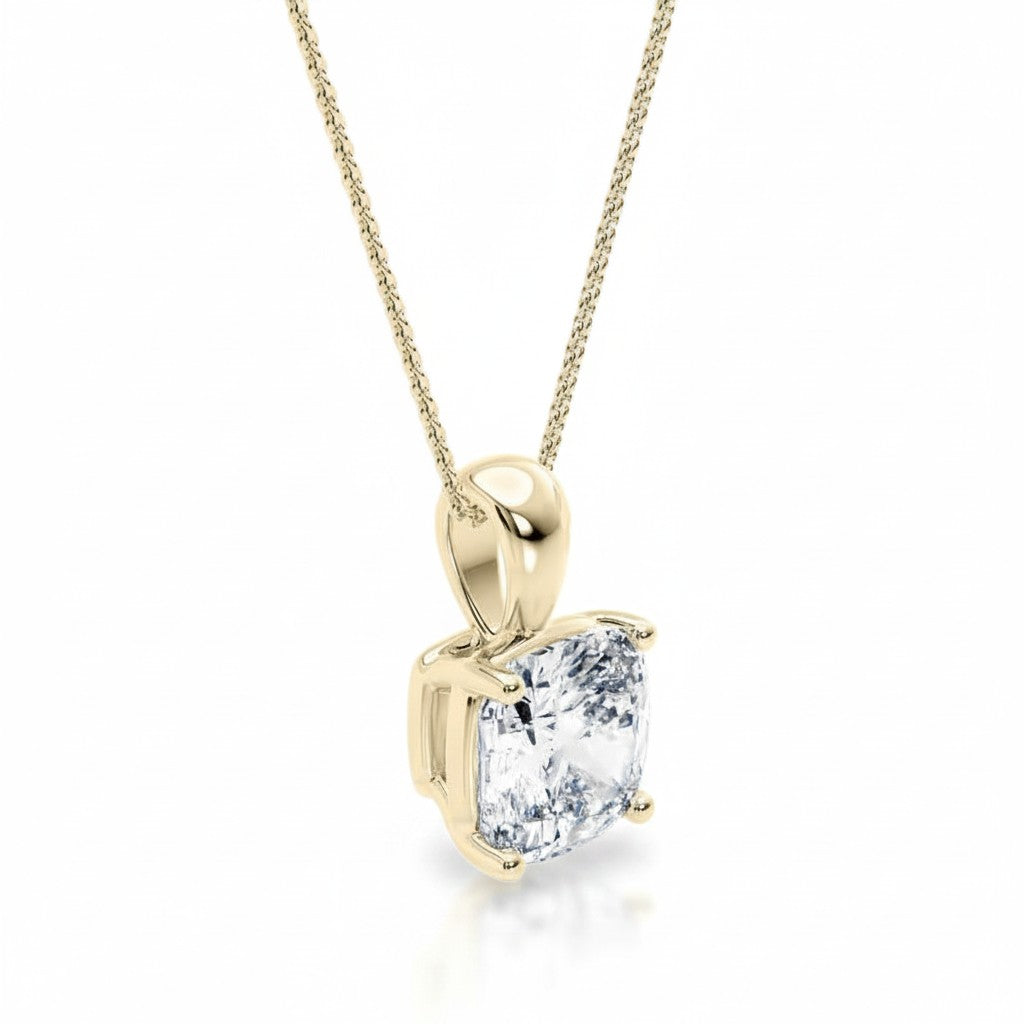 My Store 4 cushion-cut diamond solitaire pendant in 18K yellow gold with a tapered bail on a delicate gold chain.