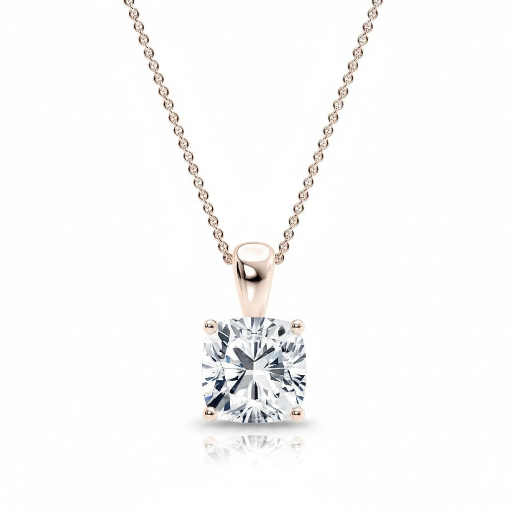 My Store 4 cushion-cut diamond solitaire pendant on a delicate gold chain with a four-prong setting.
