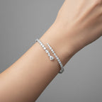My Store 4 contemporary bypass bangle featuring mixed round, marquise, and pear-cut diamonds on a gold cuff.