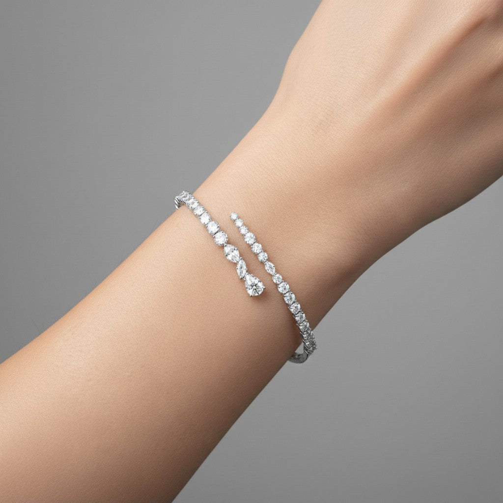 My Store 4 contemporary bypass bangle featuring mixed round, marquise, and pear-cut diamonds on a gold cuff.