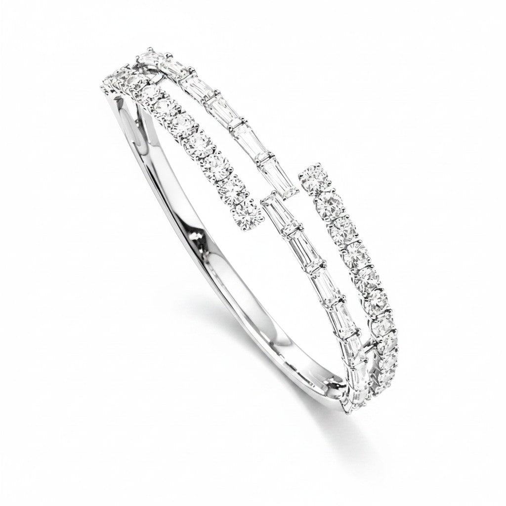 My Store 4 open bypass bangle bracelet in white gold featuring alternating rows of baguette and round cut diamonds.