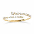My Store 4 contemporary gold bypass bangle featuring round, marquise, and pear-cut diamonds in a hinged open design.