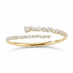 My Store 4 contemporary gold bypass bangle featuring round, marquise, and pear-cut diamonds in a hinged open design.