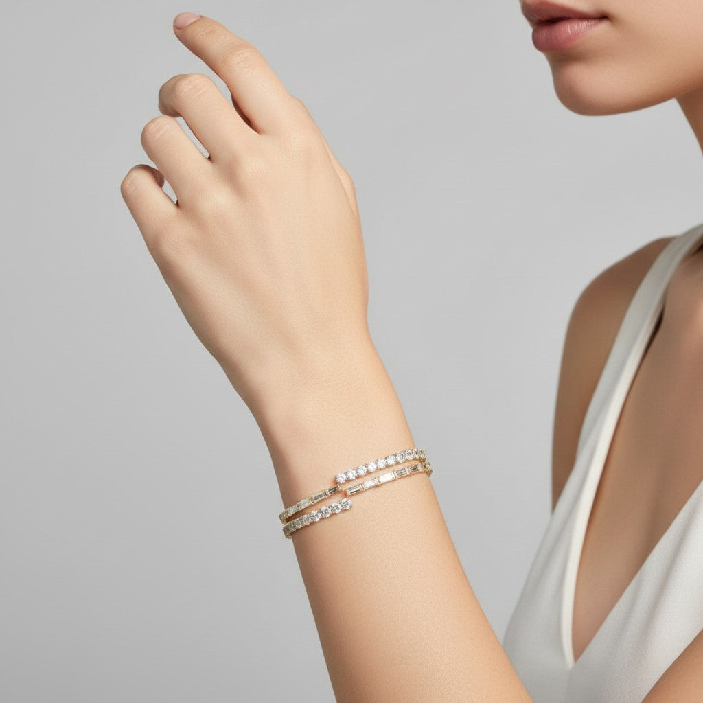 My Store 4 bypass open bangle bracelet featuring alternating baguette and round diamonds on a woman's wrist.